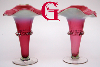 An opalescent cranberry glass pair of vases